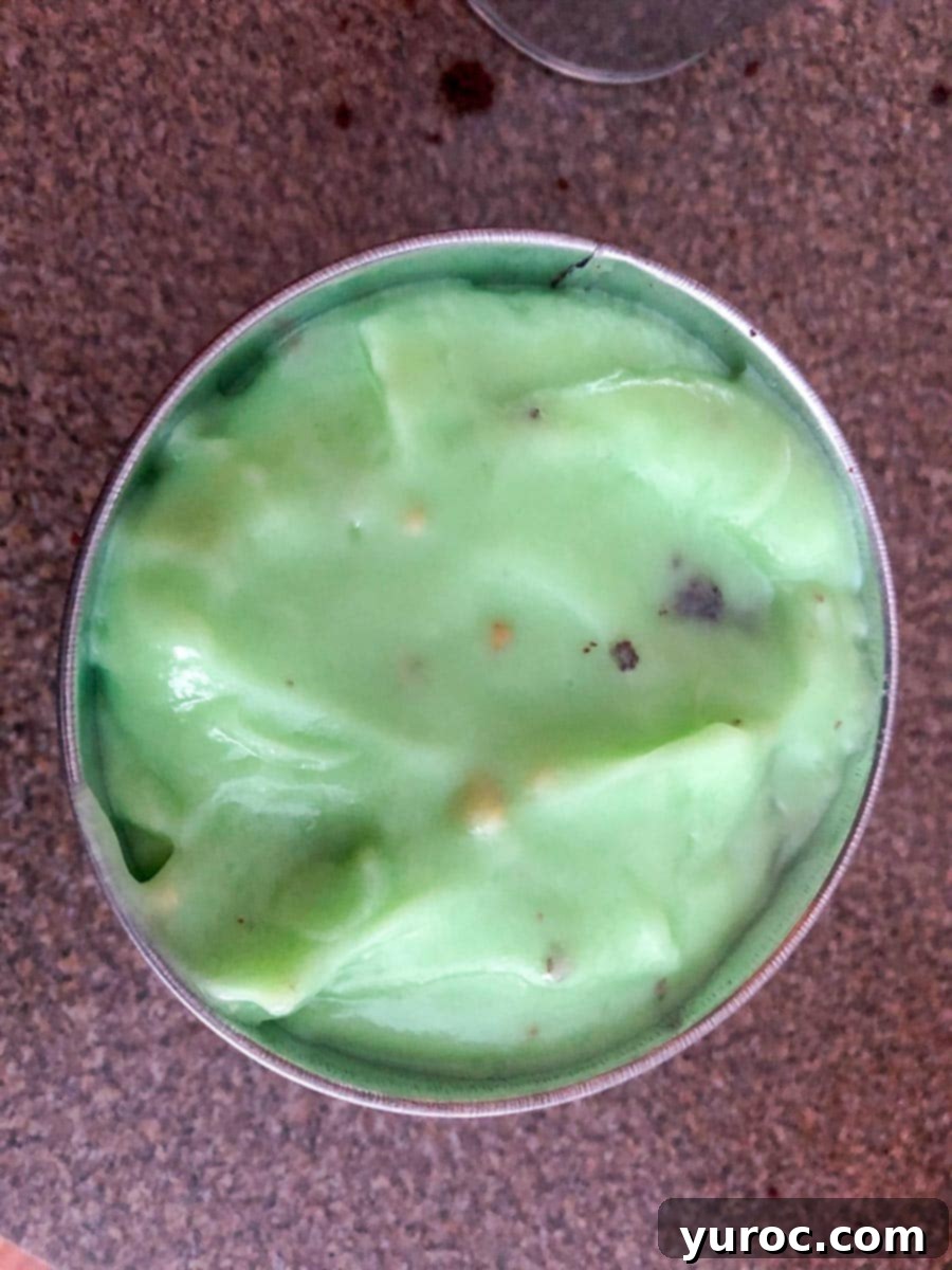 Pudding spread evenly over cake in container