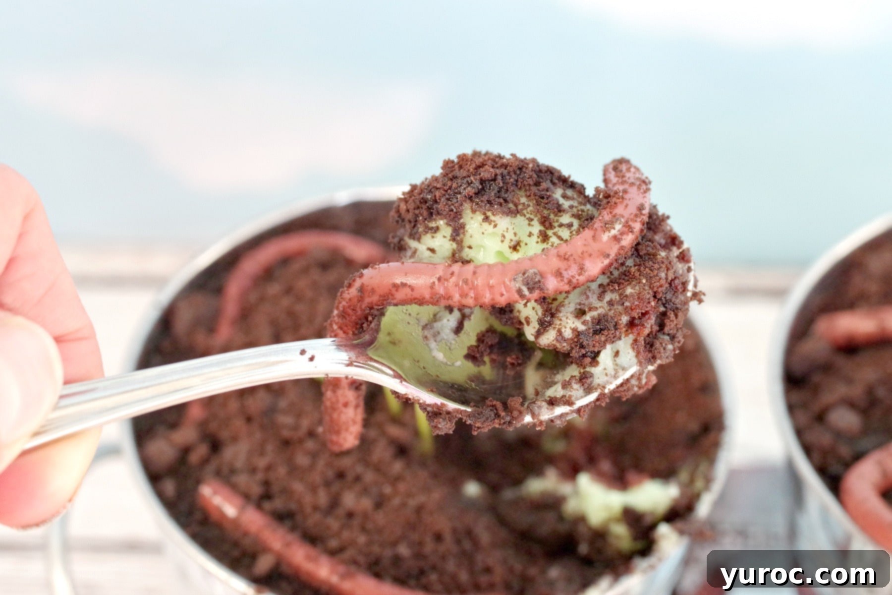 dirt and jello worms on a spoon