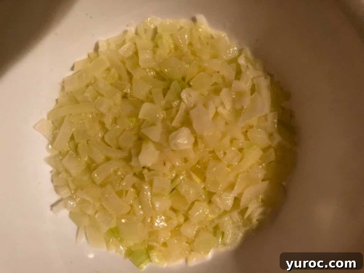 onions cooked in butter in white bowl