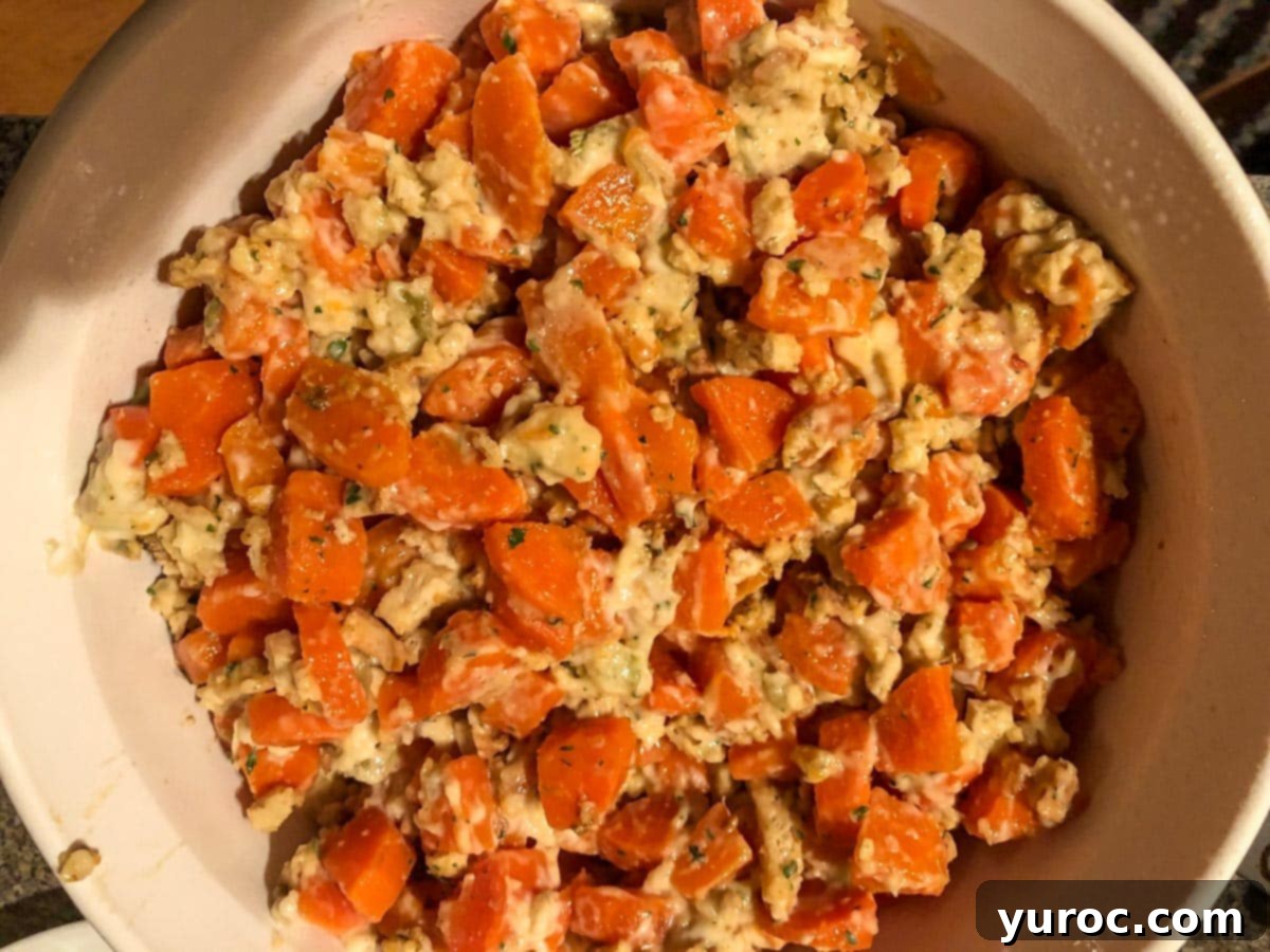 stuffing mixed with carrots and other ingredients in small casserole dish