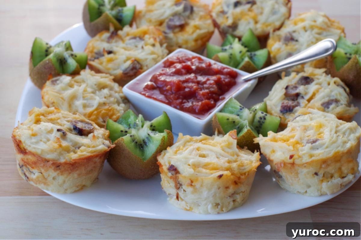 Zesty Mediterranean Chicken Rice Cups 13 Maple Sausage Brunch Bites on a white plate, garnished with kiwi flowers and a bowl of salsa