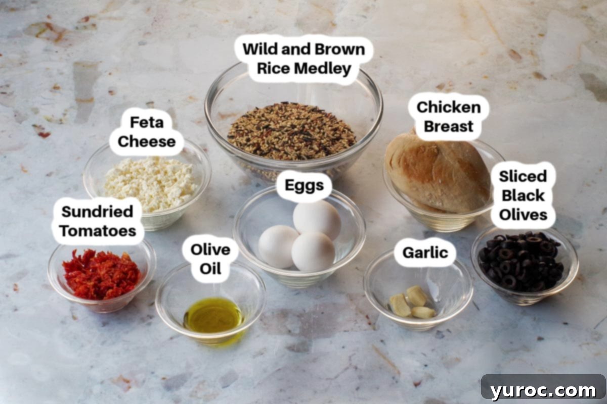 Zesty Mediterranean Chicken Rice Cups 4 Mediterranean Chicken Rice Cups ingredients laid out in glass bowls, including rice, chicken, sun-dried tomatoes, olives, and feta
