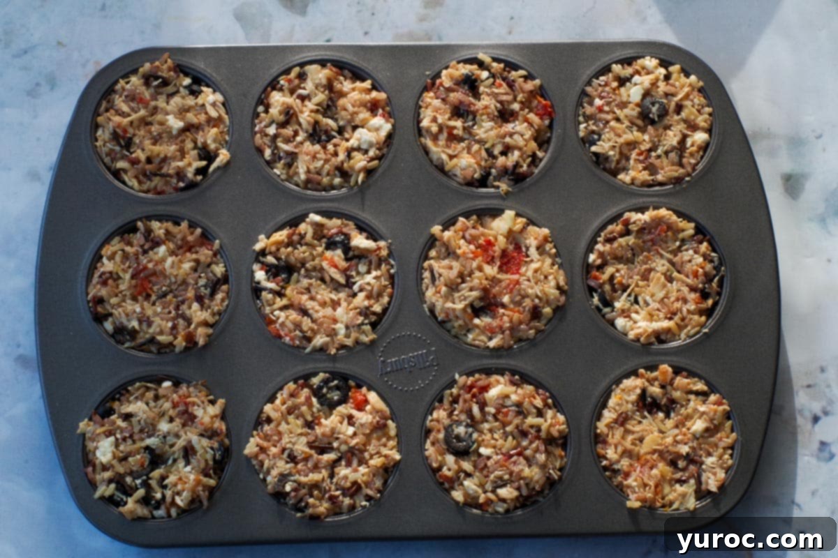 Zesty Mediterranean Chicken Rice Cups 9 All 12 muffin tin cavities filled with rice mixture, pressed tightly