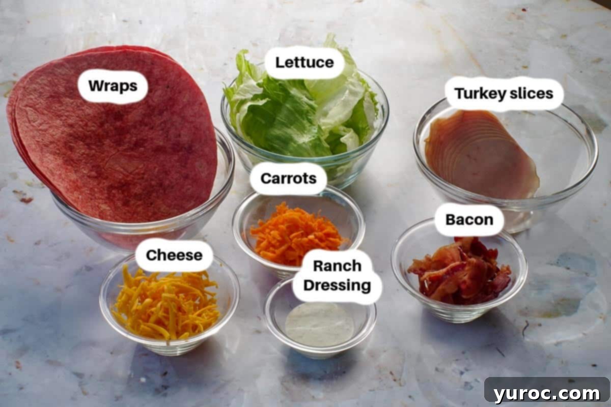Ultimate Turkey Bacon Ranch Wrap 3 Close-up of fresh ingredients for Turkey Bacon Ranch Wraps, including turkey, bacon, cheese, and ranch dressing.