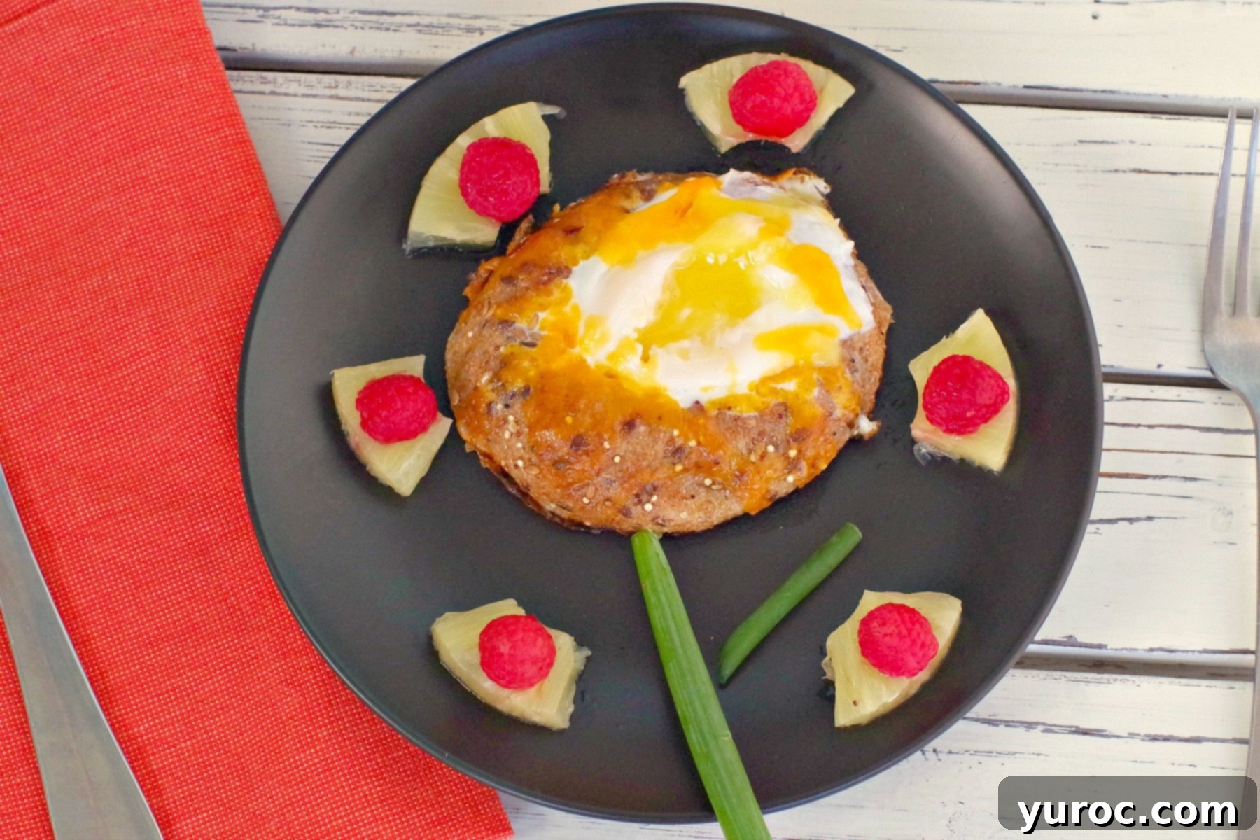 bagel toad in a hole on black plate