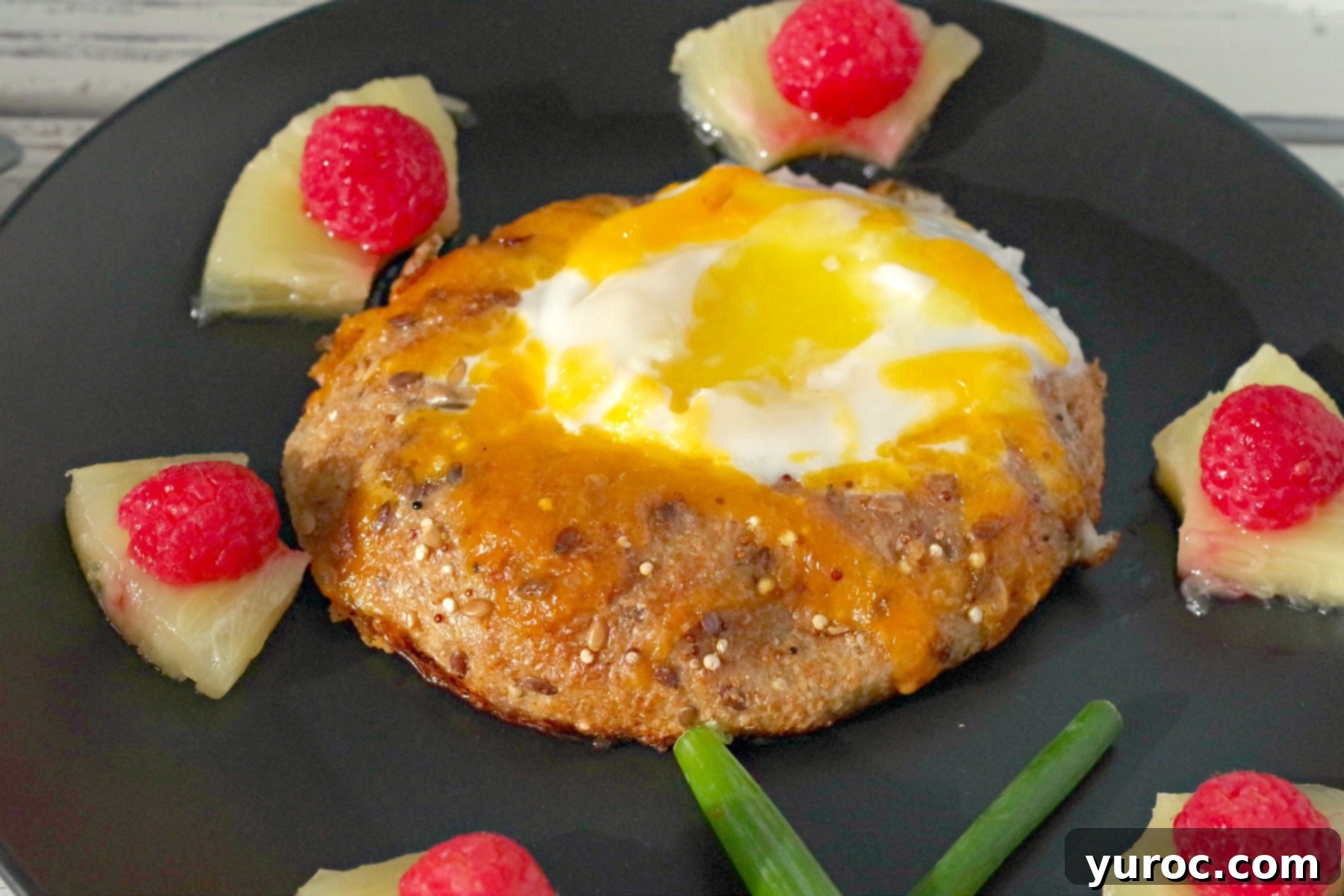 bagel toad in a hole on black plate