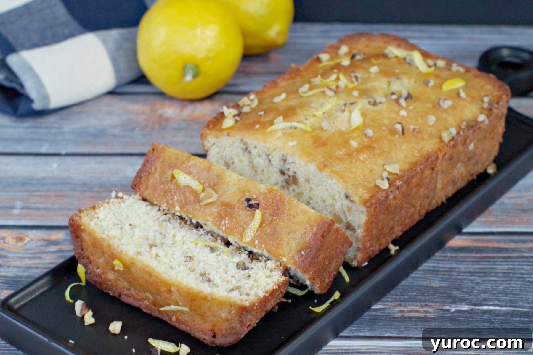 sliced lemon loaf on black tray