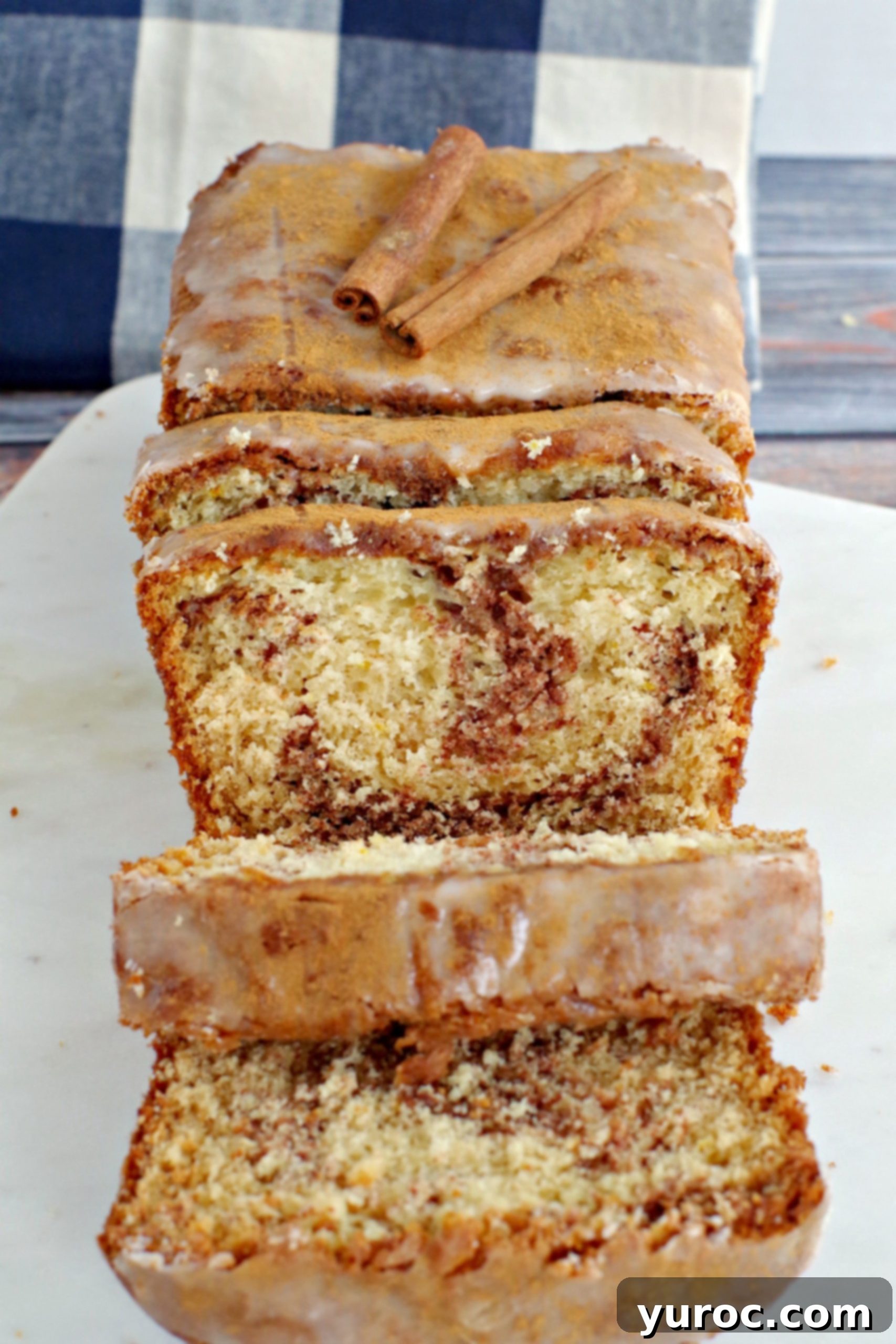 Sliced cinnamon swirl bread on a marble board