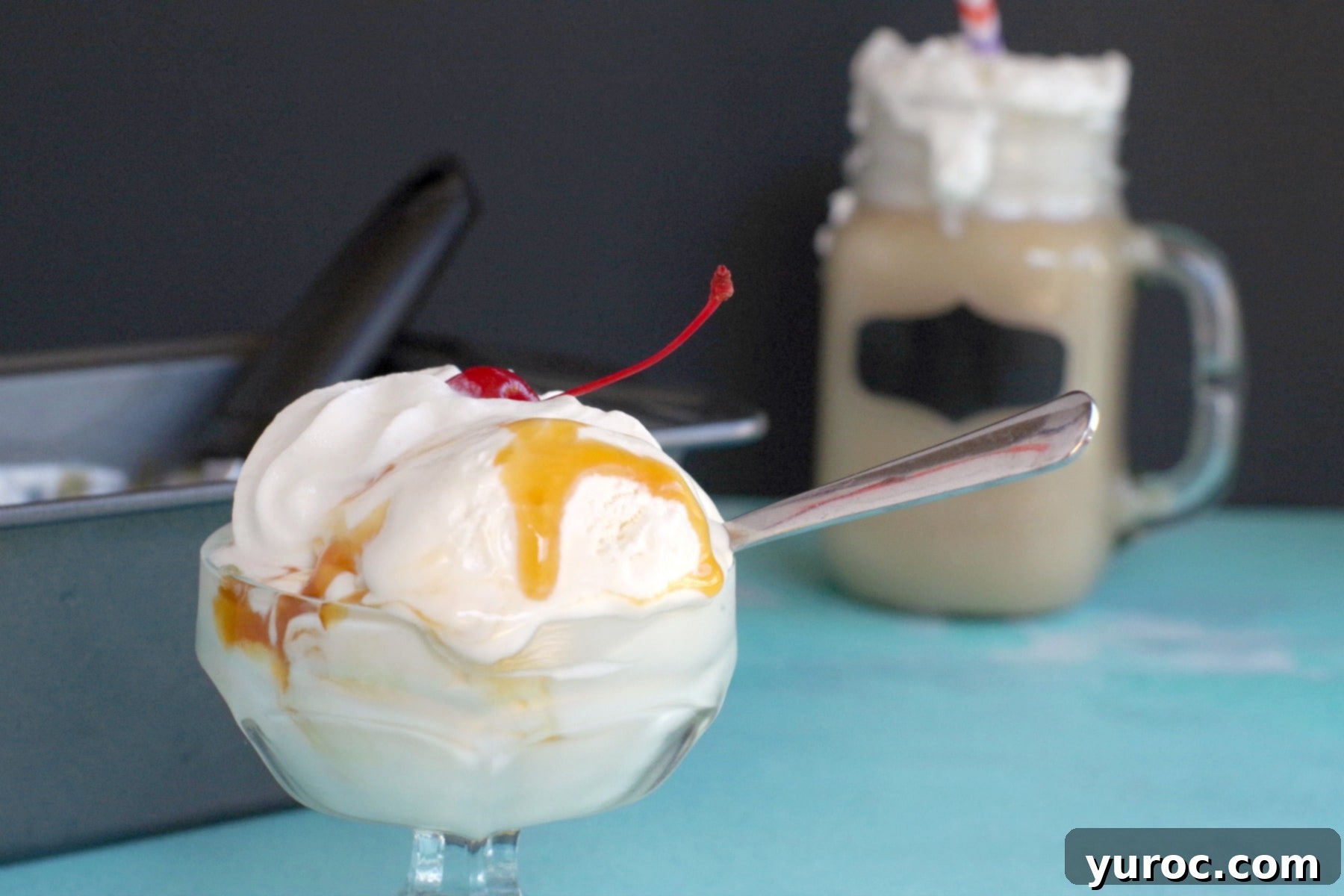 butterbeer ice cream in clear dish with butterbeer in the background