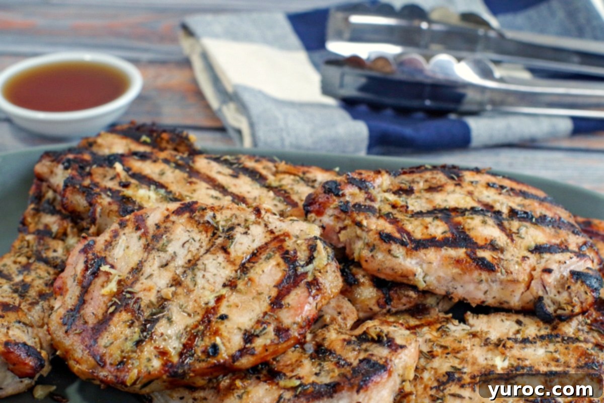 Several pieces of marinated grilled lemon pork piled on a platter