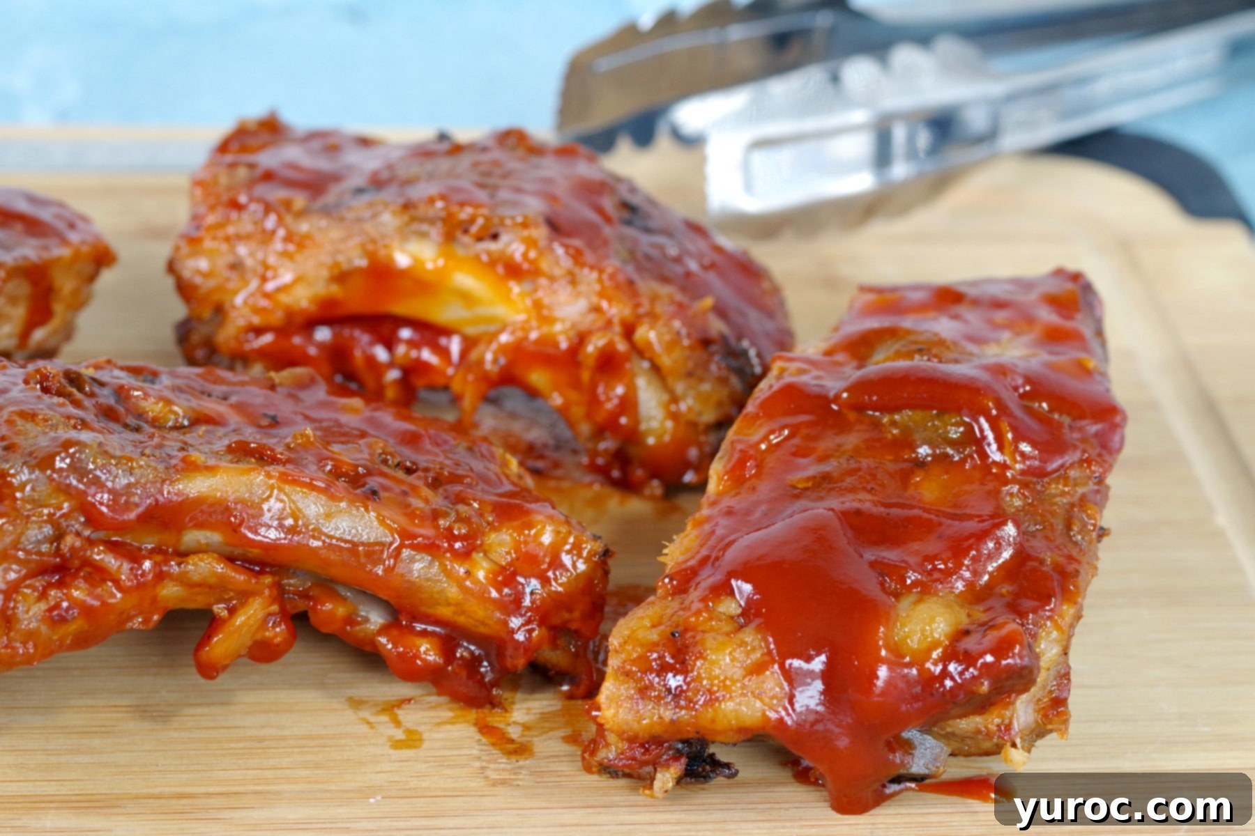 slow cooker BBQ beer ribs on a cutting board
