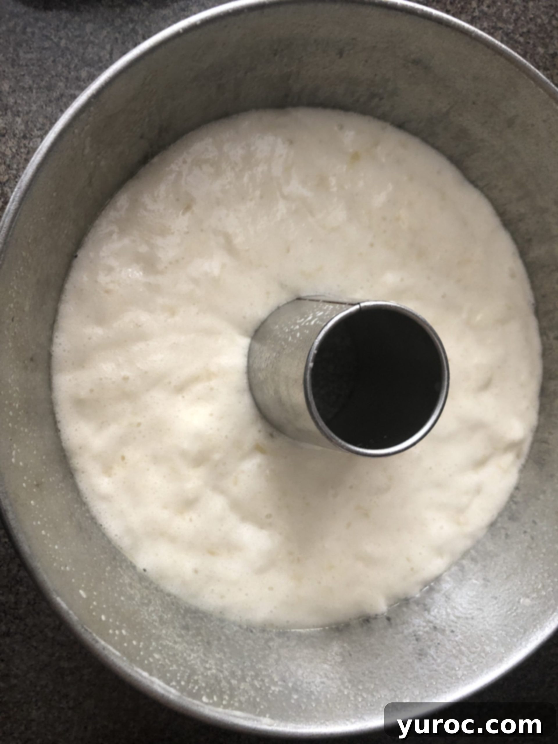 Pina Colada Angel Food Cake batter poured into a greased angel food cake pan