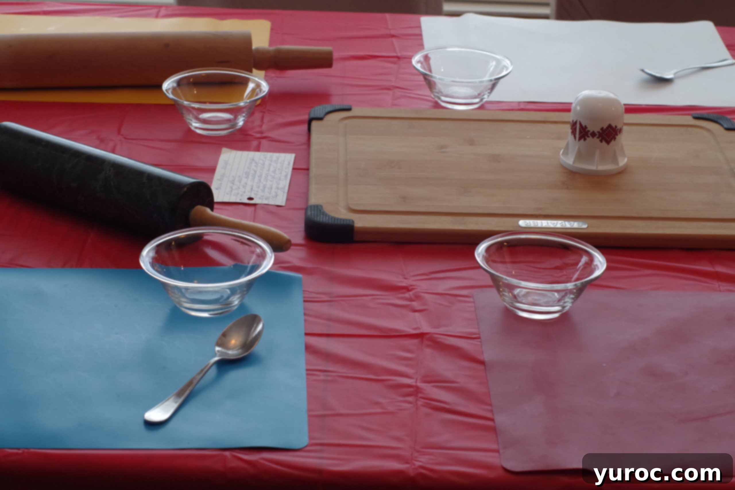 table set up for perogy party with cutting board, rolling pins etc..