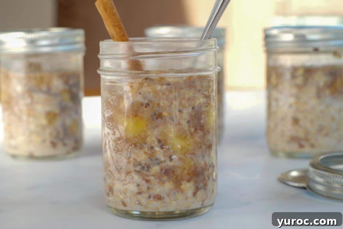 Wholesome Bananas Foster Overnight Oats 2 Bananas Foster Overnight Oats in a jar with jars in overnight oats behind