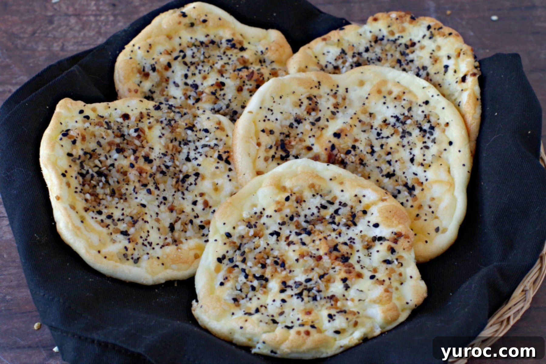 everything bagel cloud bread on black napkin in bread basket