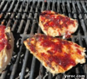 cranberry glaze on chicken on grill