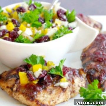 Maple Cranberry Glazed Grilled Chicken with Zesty Cranberry Salsa 5 grilled chicken on white tray will salsa in white dish in background