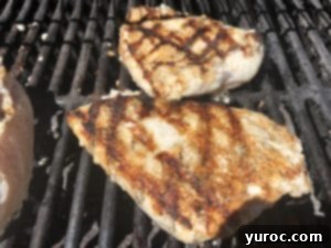 chicken cooking on grill