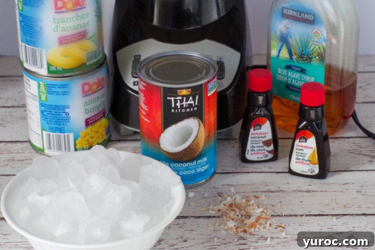 A selection of ingredients for a Healthy Pina Colada, including canned crushed pineapple, light coconut milk, extracts, and agave syrup.