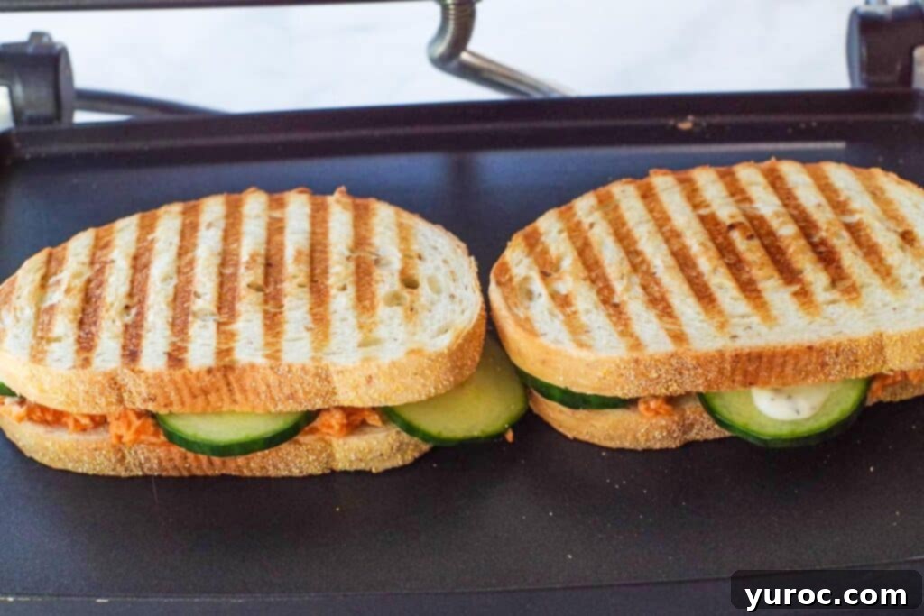 2 buffalo chicken paninis on the panini press