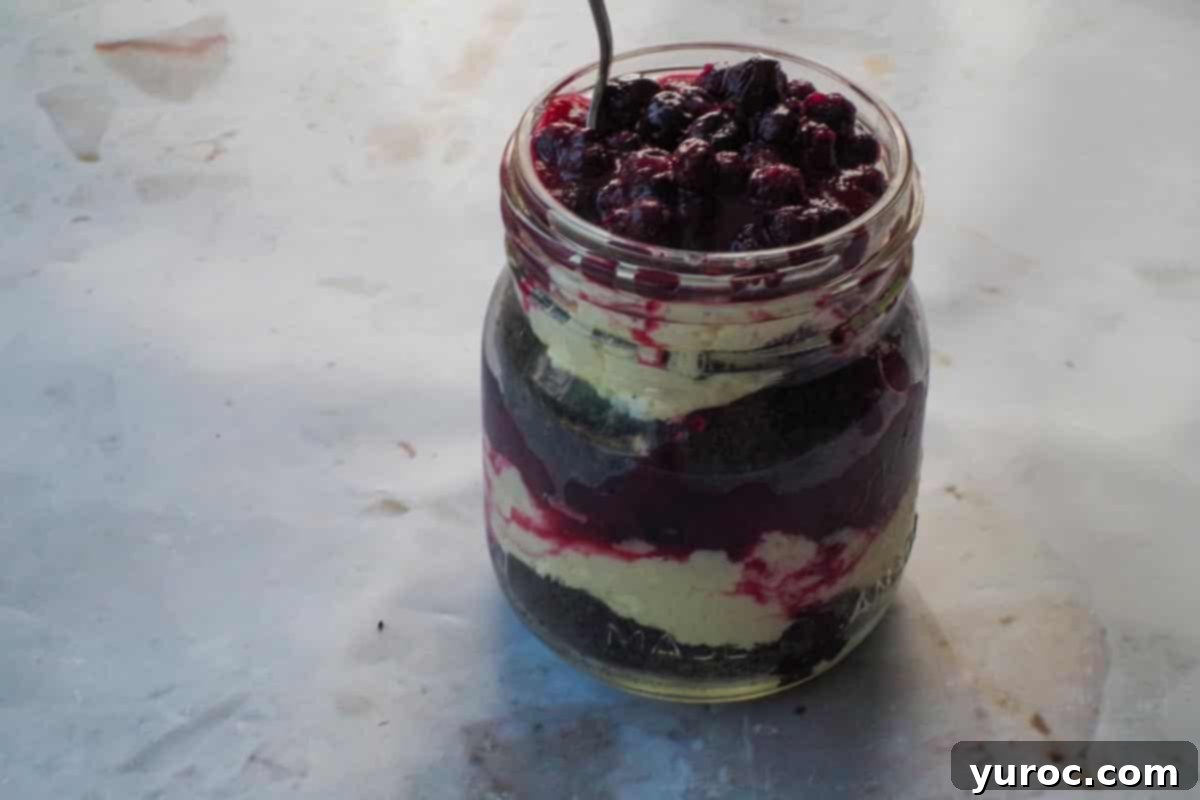 No-Bake Saskatoon Berry Cheesecake Jars 11 Layers repeated and added to the mason jar.