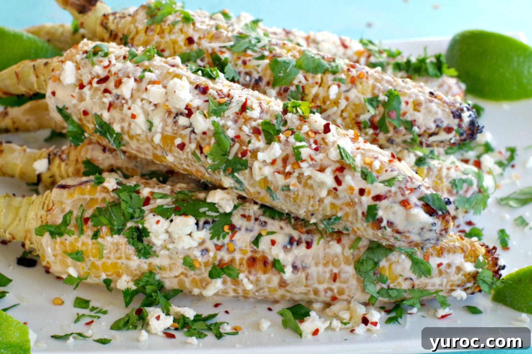 grilled mexican street corn on a white platter
