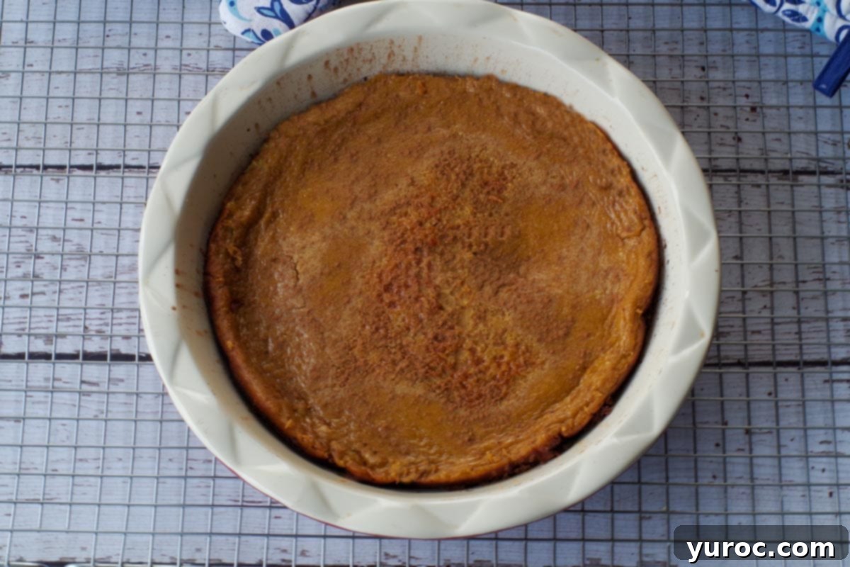 freshly baked crustless pumpkin pie cooling on a wire rack