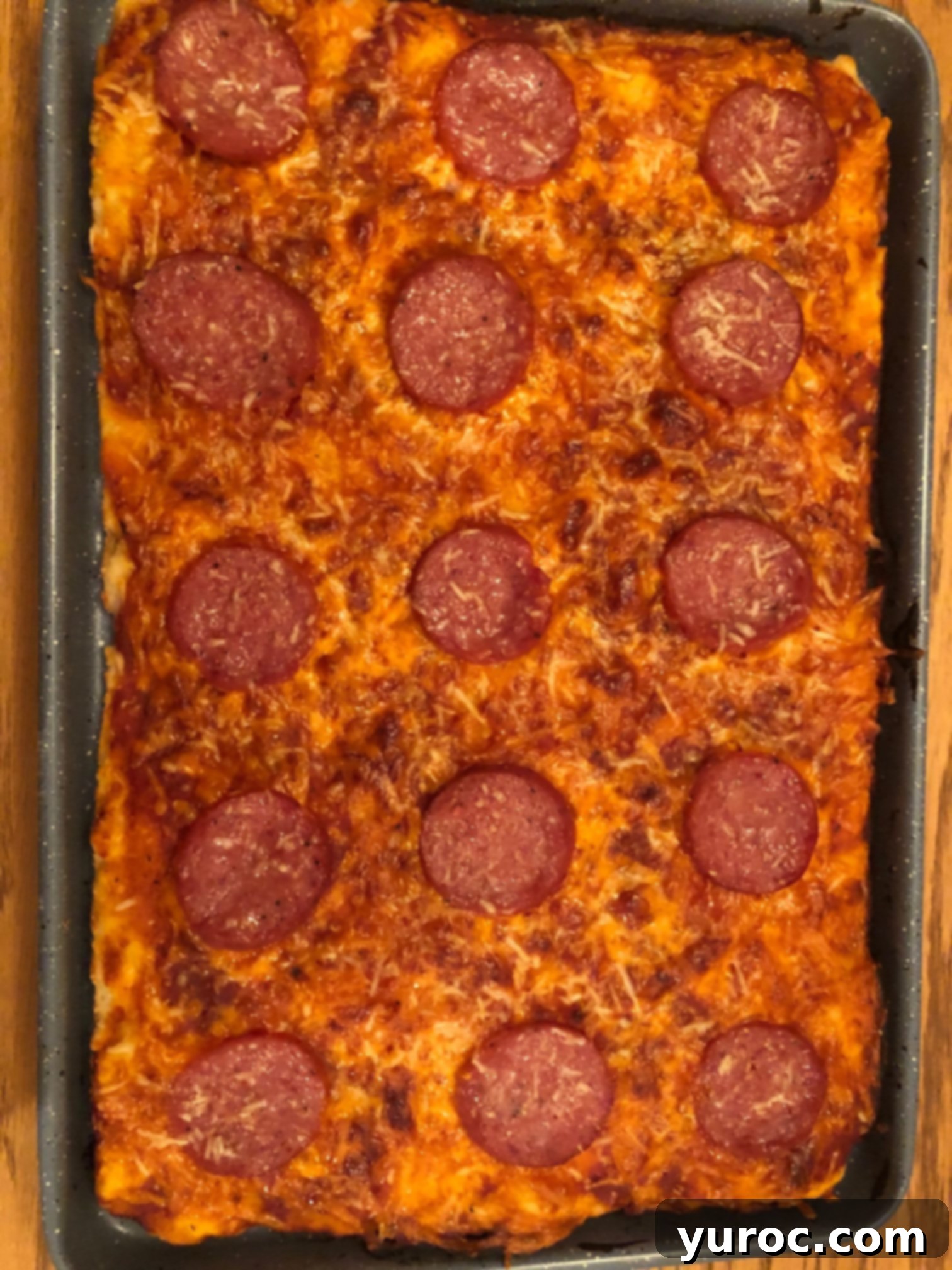 cooked pizza removed from oven