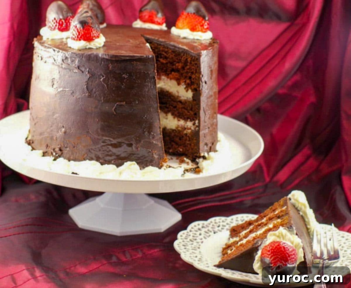 A delectable slice of red wine chocolate cake with a creamy filling, positioned in front of a whole cake with a missing piece, ready to be enjoyed.