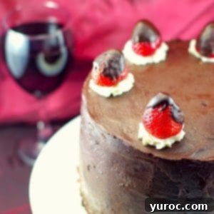 Red Wine Chocolate Strawberry cake top view with glass of red wine in the background