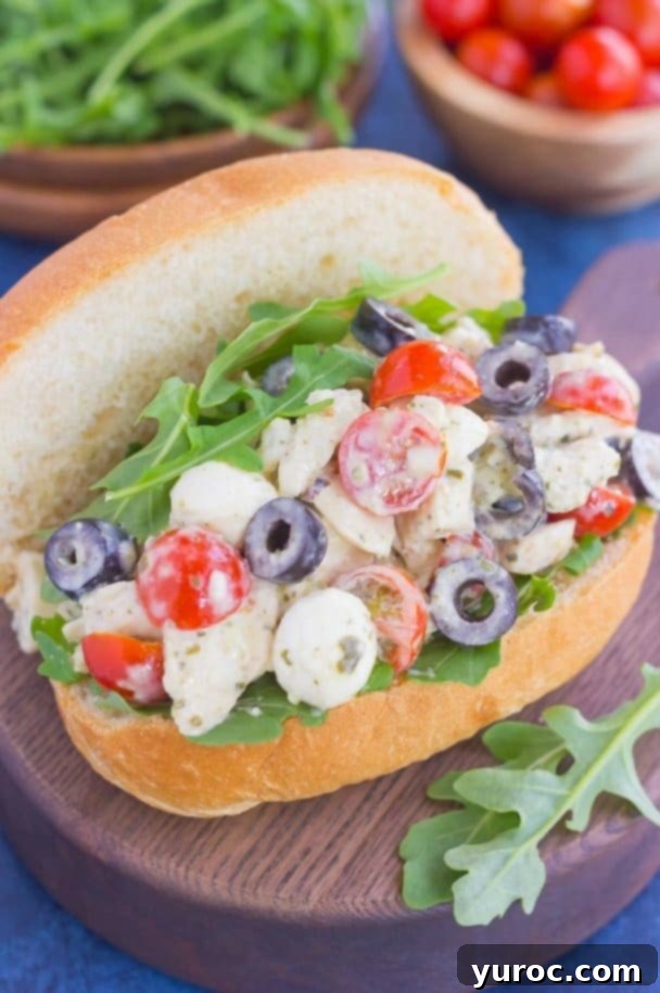 15 No-Prep Healthy School Lunches for Teens 8 open Italian chicken salad sandwich with mozzarella, tomatoes, black olives and pesto