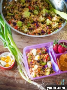 15 No-Prep Healthy School Lunches for Teens 9 lunchbox fried rice salad in bento box in front with more fried rice salad in background, best served cold