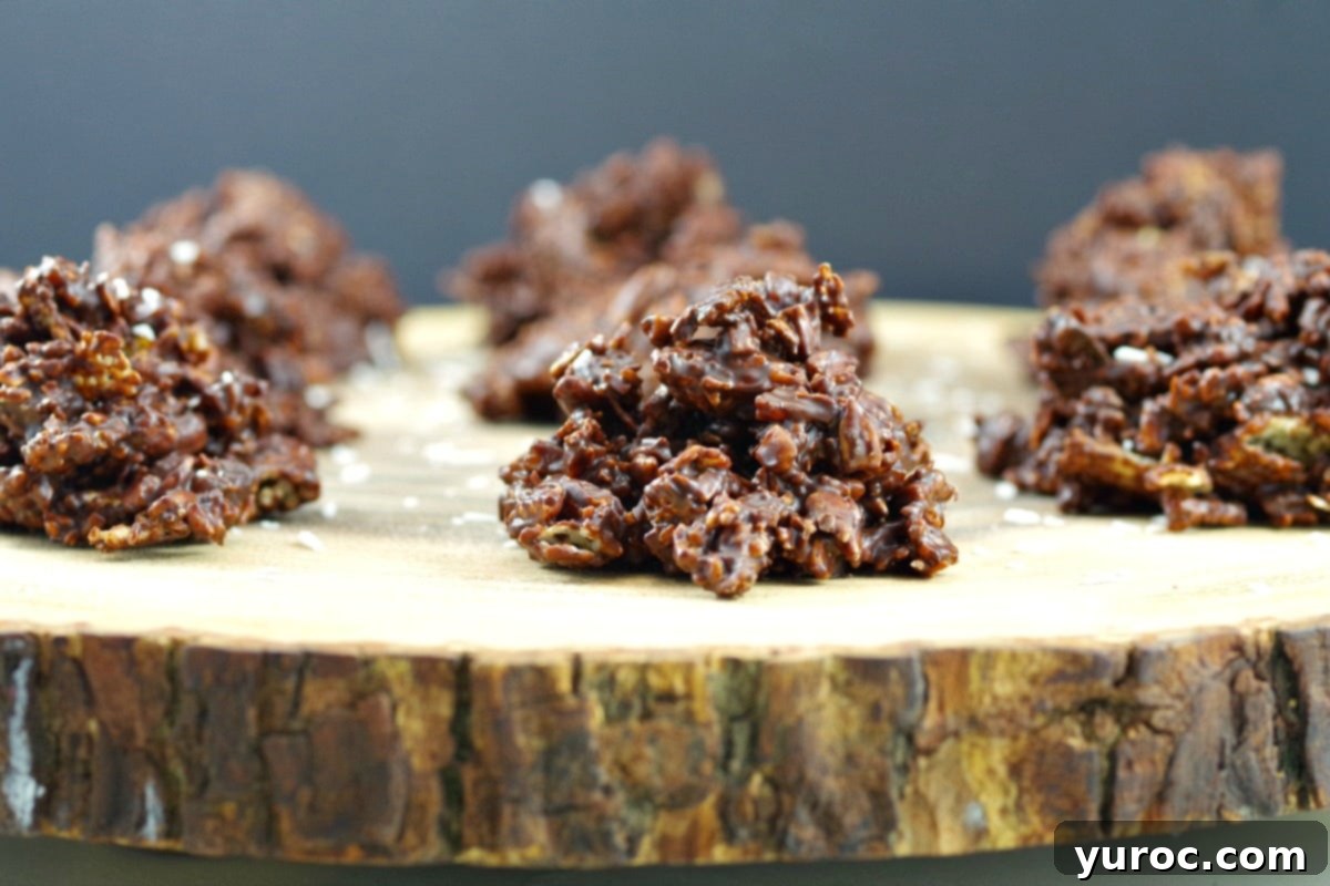 Healthy Chocolate Cluster on a wooden display with more chocolate cluster in background