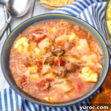slow cooker breakfast soup in a blue bowl on blue and white striped linen