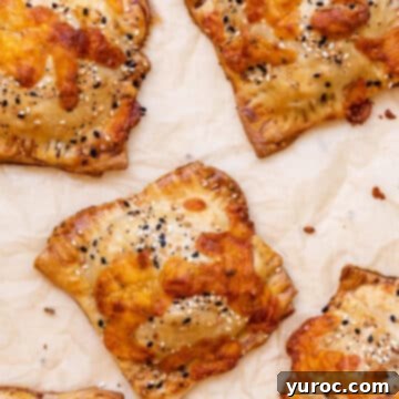 Savory Breakfast Hand Pies on parchment paper