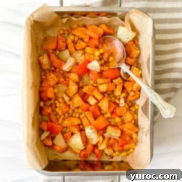 overhead view of sweet potato corn hash in a pan lined with parchment
