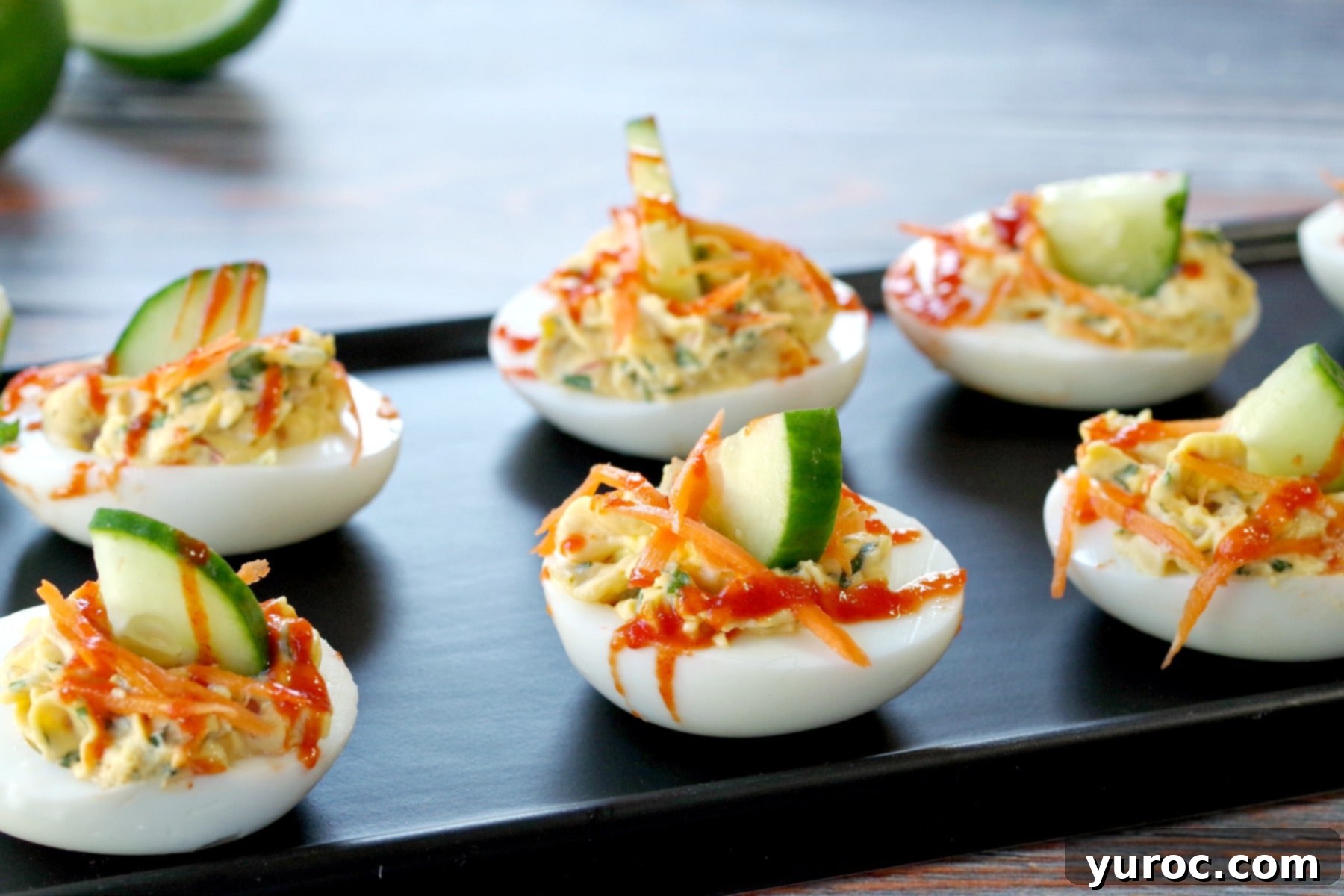 banh mi devilled eggs on a narrow black serving platter