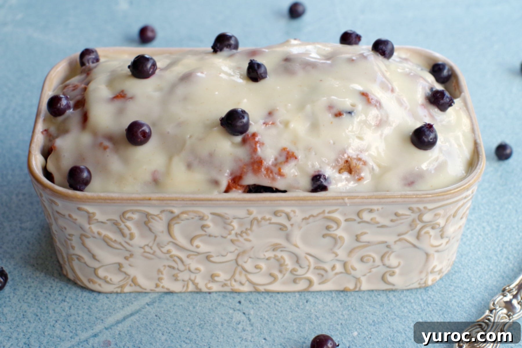 A freshly baked whole Saskatoon berry loaf cooling in its loaf pan