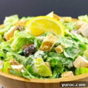 Chicken Caesar Salad in a wooden salad bowl.