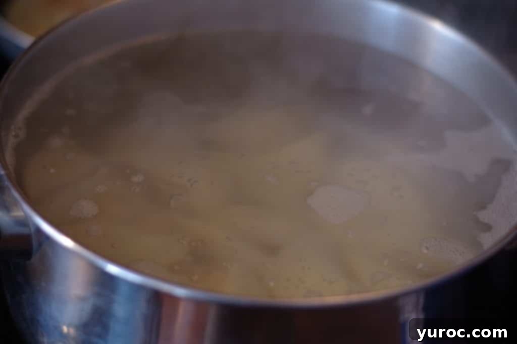 Perogies cooking in a pot of boiling water