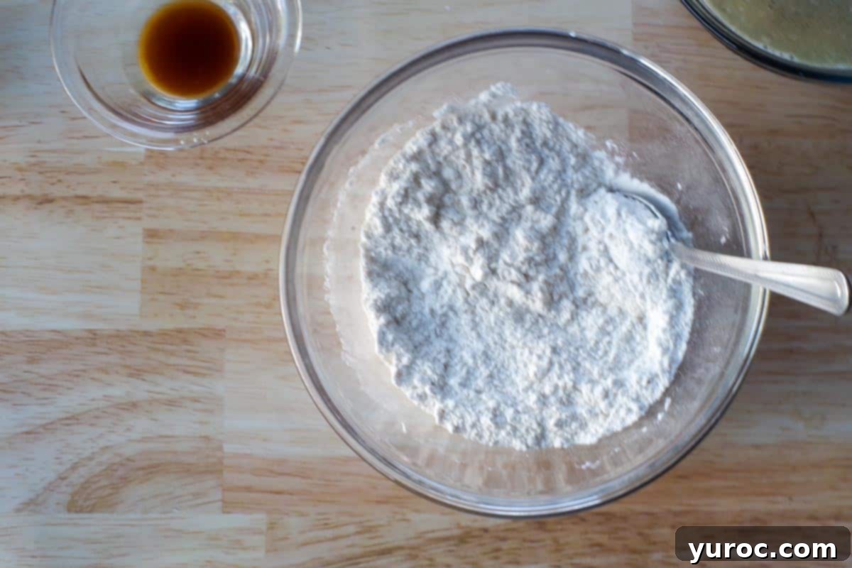 flour and baking soda sifted together in medium glass bowl