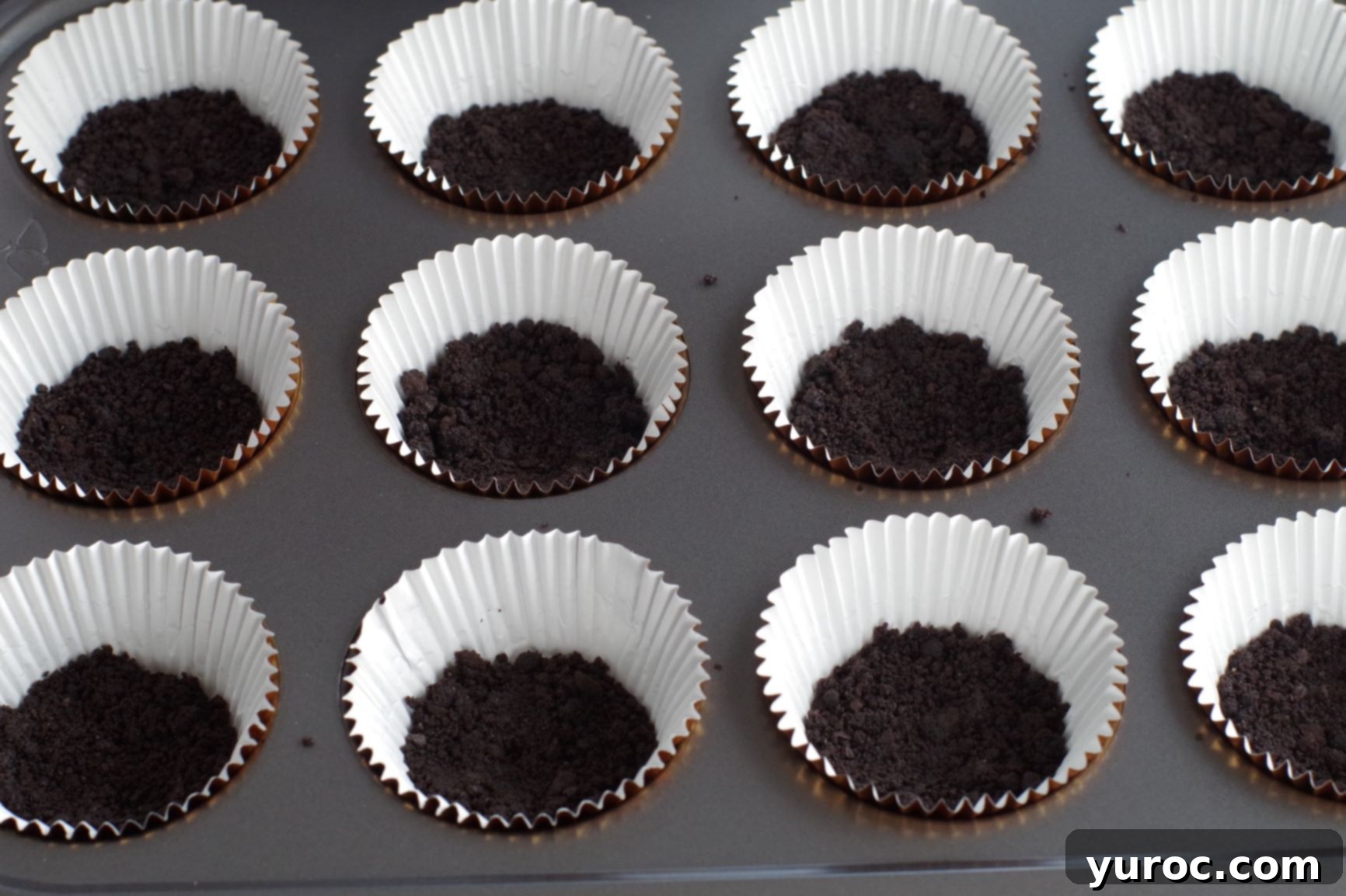 Effortless No-Churn Ice Cream Cupcakes 4 base pressed into bottom of cupcake liners