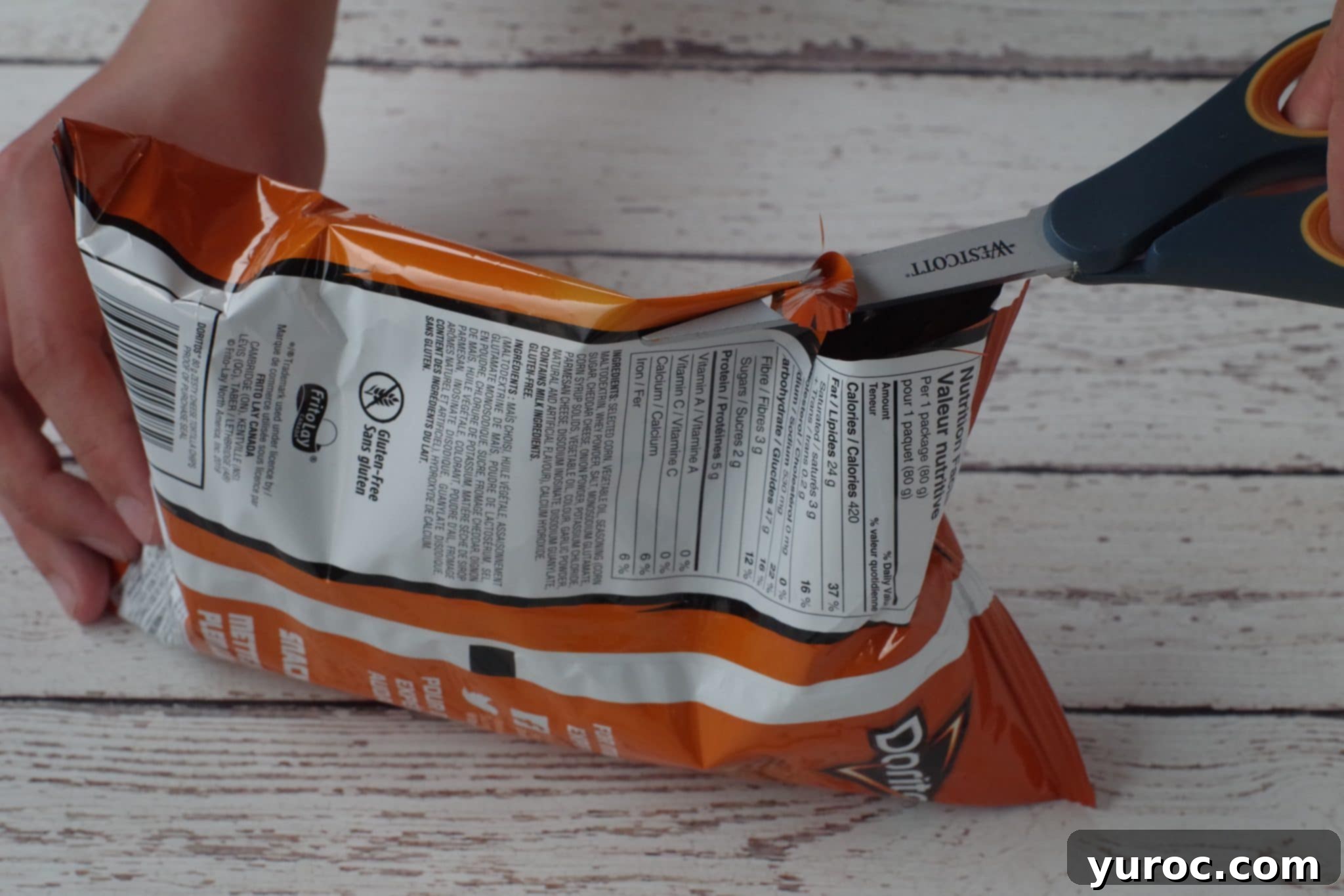 tortilla chips bag being cut open