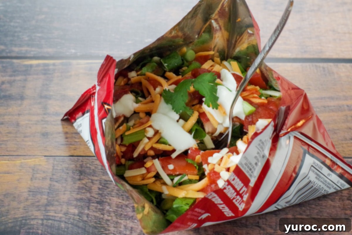 tacos in a bag with fork, on wooden surface