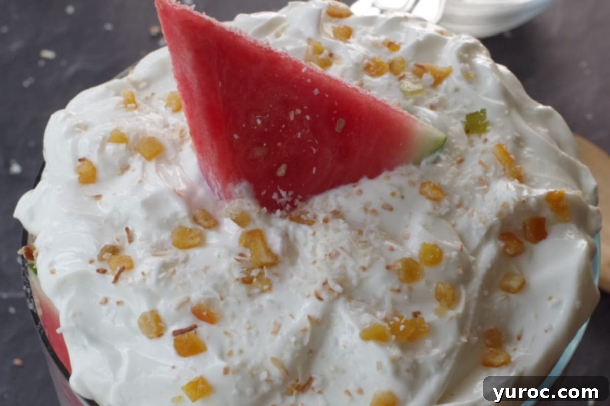 Refreshing Watermelon Granola Parfait 15 Watermelon trifle finished with yogurt on top and garnished with candied citrus peel and a slice of watermelon.