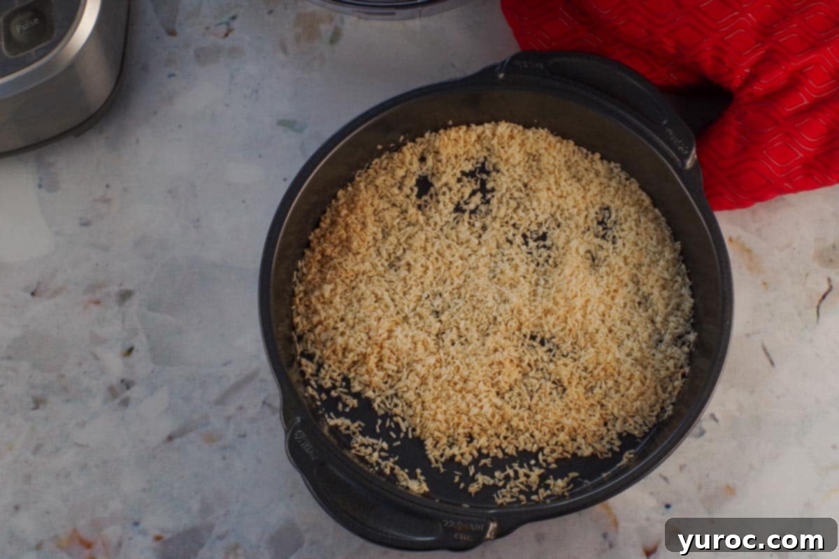 Refreshing Watermelon Granola Parfait 7 Toasted coconut in a round baking pan.