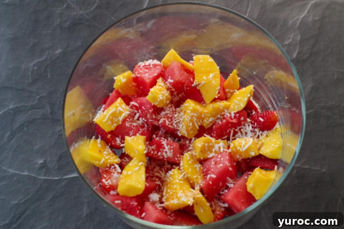Refreshing Watermelon Granola Parfait 8 chunks of watermelon, mango and strawberries, sprinkled with toasted coconut in the bottom of a trifle bowl