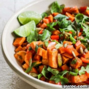 Sweet potato salad with chili lime dressing in a white bowl (with half the bowl showing).